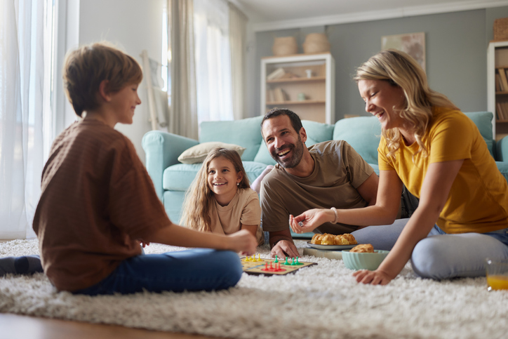 happy family playing on the living room floor